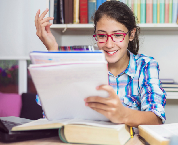 Happy-teenage-girl-learning-at-home-803005062_6720x4480 1